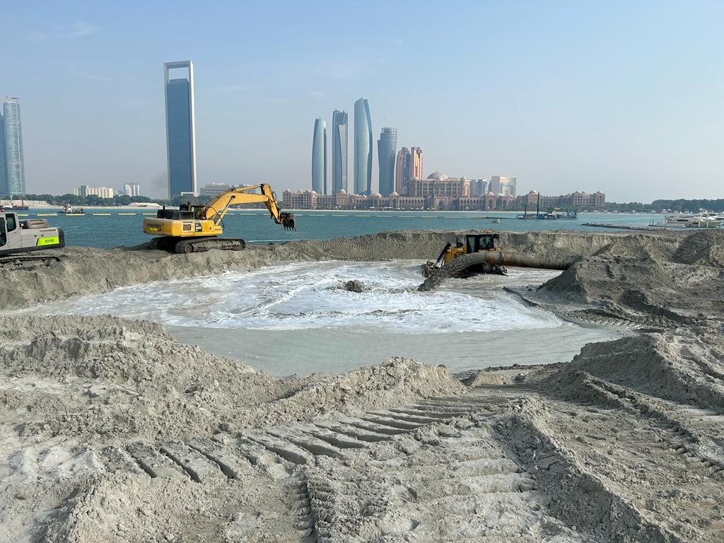 Reclamation works with the Abu Dhabi skyline behind
